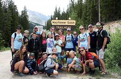 Large group of young people out on a hike near the Mayflower Gulch Trailhead.